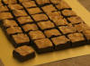 Honing Walnoot Bonbon. Extra grote bonbon met heerlijke walnoten. Room, suiker, honing, walnoot, pure chocolade 66%.
